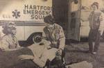 Hartford emergency squad administers oxygen outside an ambulance by Advocate Aurora Health