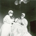 Student nurses pretending to perform a procedure on a patient by Advocate Aurora Health